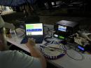 Andrew Adrian, W9AMA, from Ohio’s Clinton County Amateur Radio Association (CCARA), operating at 1:00 AM with an empty plate of steak and eggs. [Photo courtesy of Roy Hook, W8REH] 